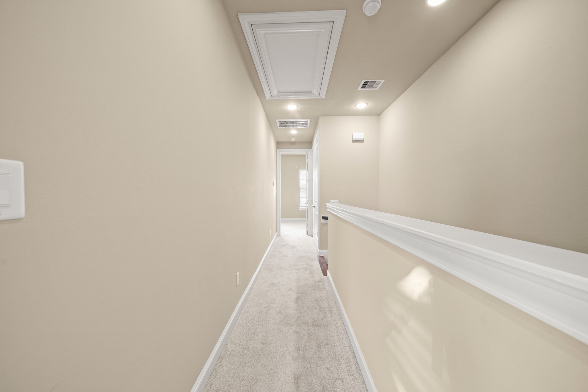 1250 West 23rd Street Houston, TX 77008 - Photo 39 of 50 The upstairs hall provides access to the utility room and attic!