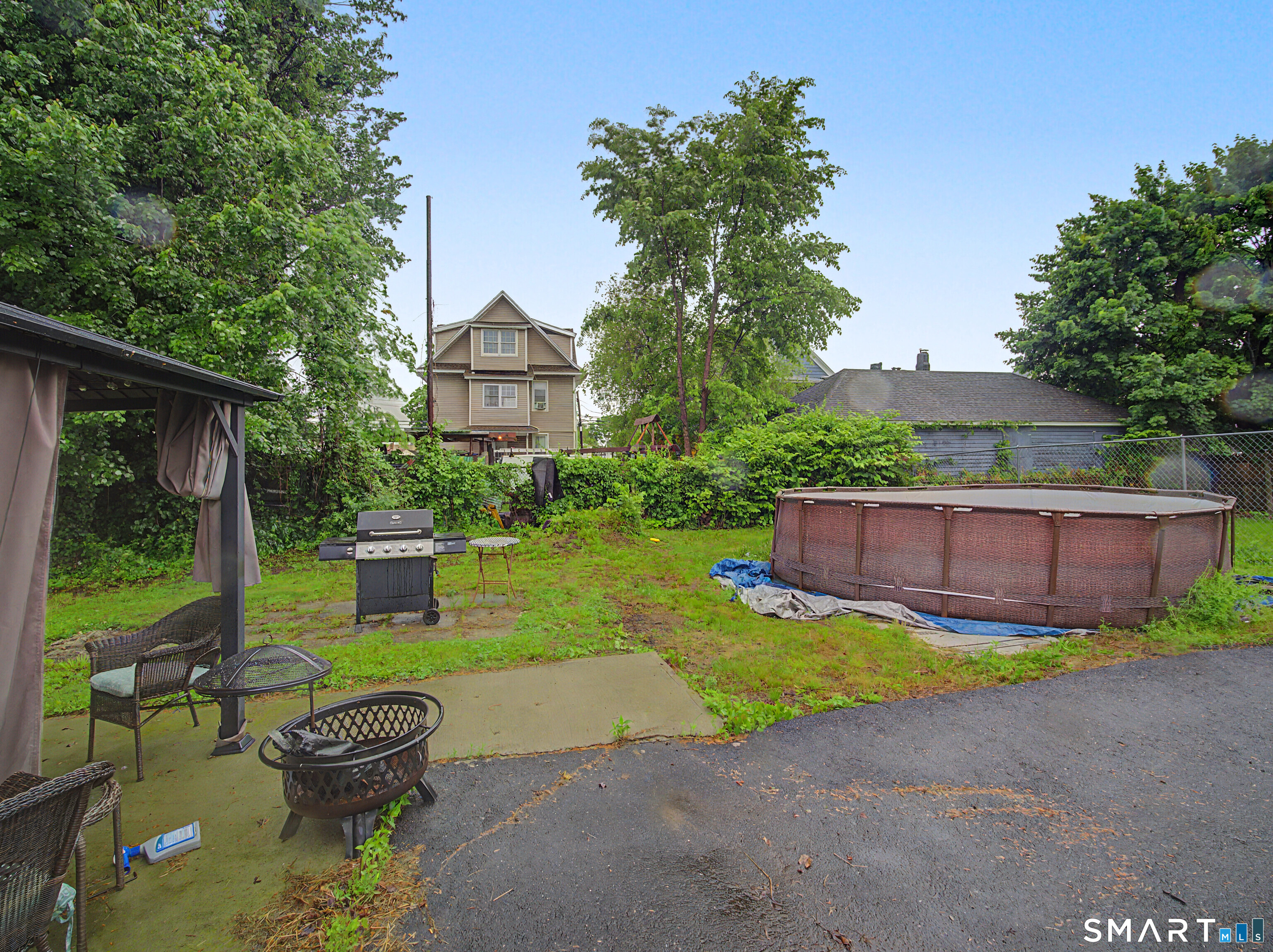 319 Carroll Avenue Bridgeport, CT 06607 - Photo 38 of 40 a view of a chair and table in backyard of the house
