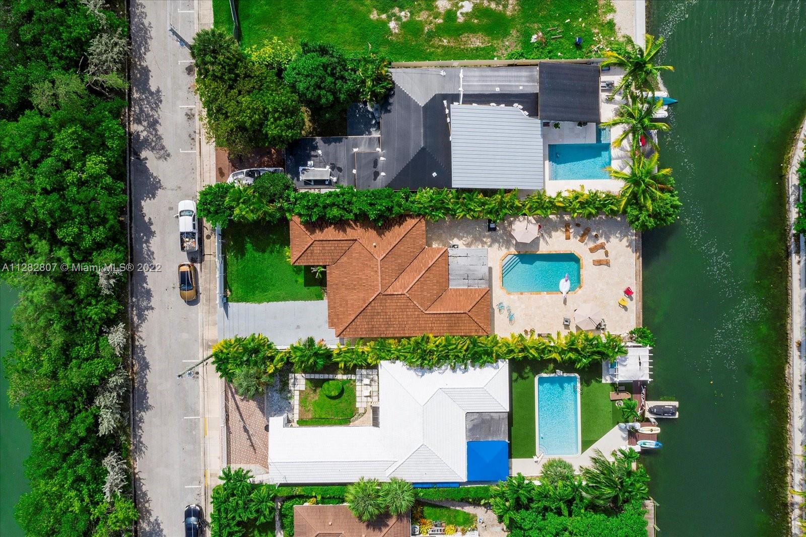 an aerial view of a house with a garden and yard