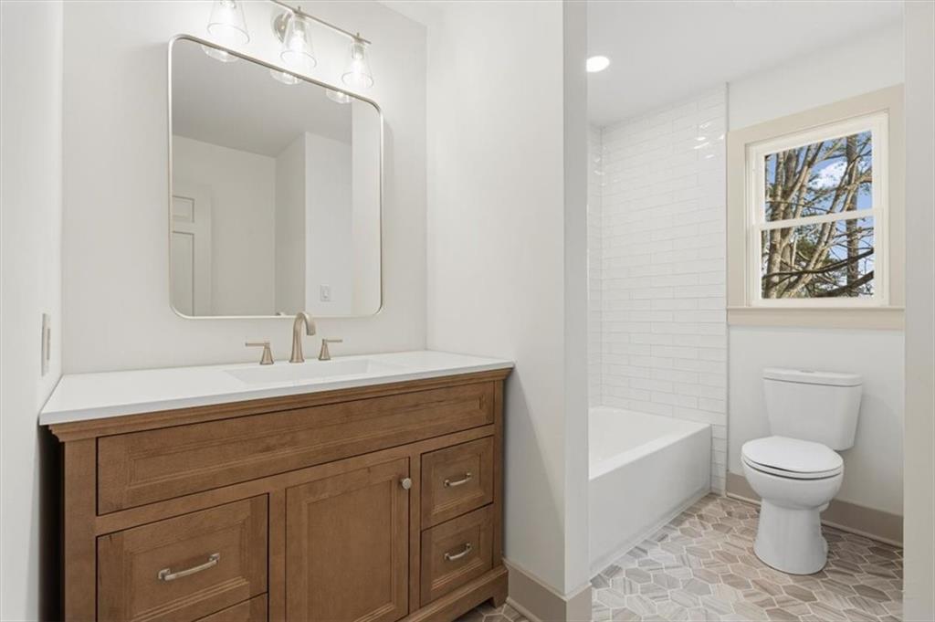 49 Apache Trail Cartersville, GA 30120 - Photo 25 of 52 a bathroom with a toilet sink and mirror