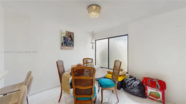 a bedroom with a bed and a tv on the dresser