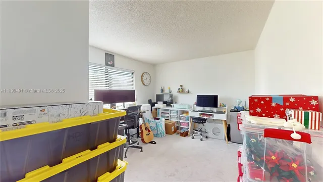 a room with furniture a rug and a window