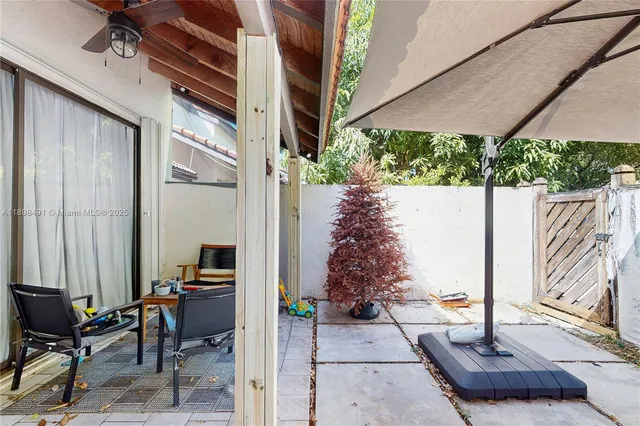 a picture of a bench in front of a wall