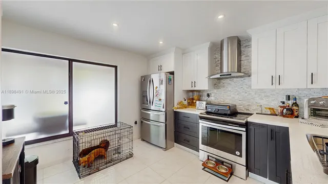 a kitchen with a sink and appliances