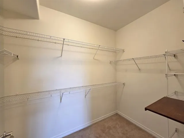 a view of a room with racks on the wall