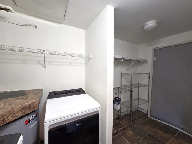 a utility room with washer and dryer