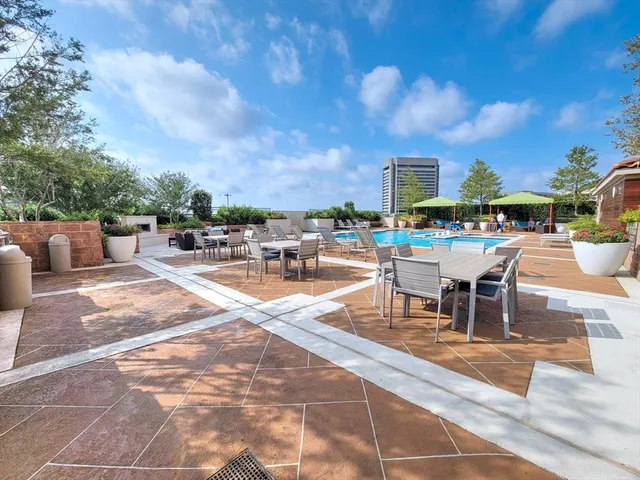 a view of a patio with swimming pool