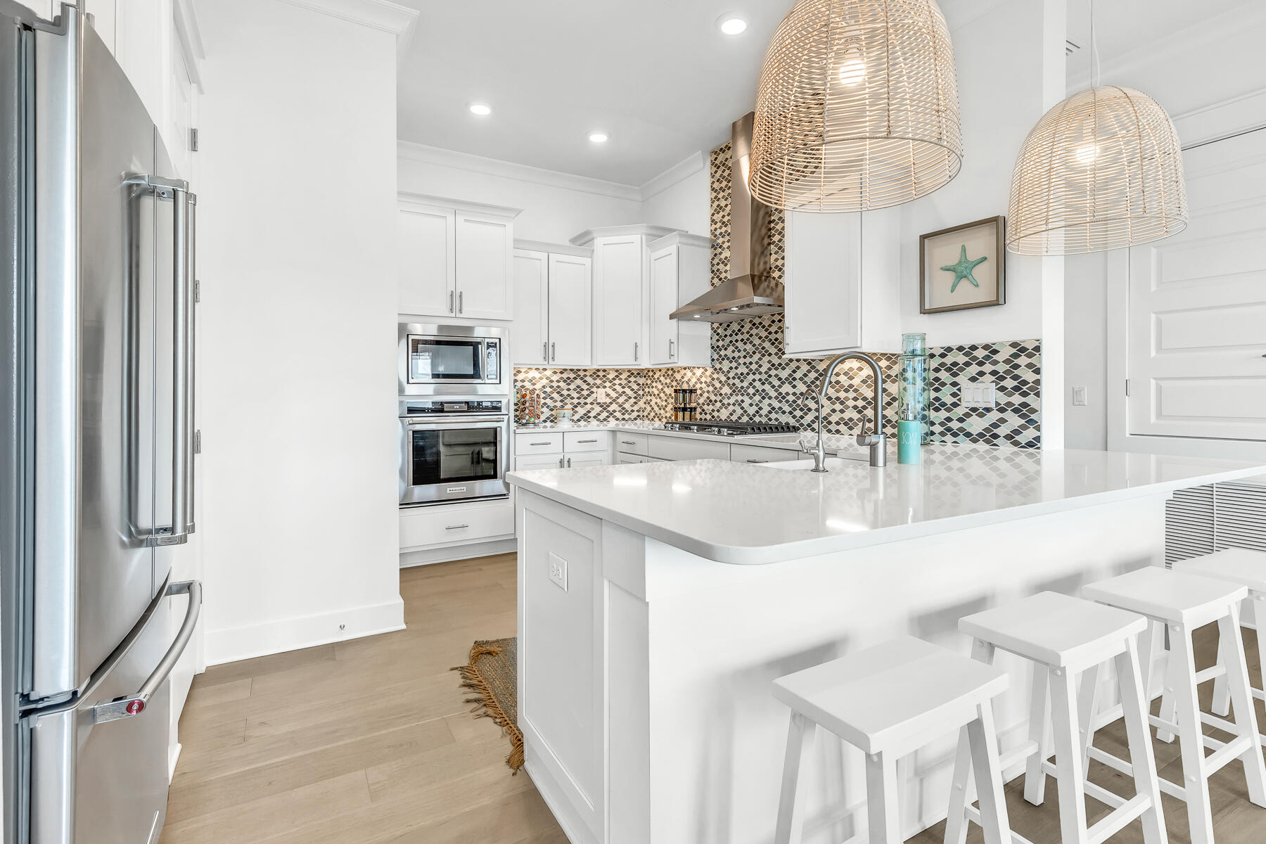 110 Wharf Ln Inlet Beach, Unit C Inlet Beach, FL 32461 - Photo 11 of 53 a kitchen with stainless steel appliances kitchen island granite countertop a refrigerator and microwave