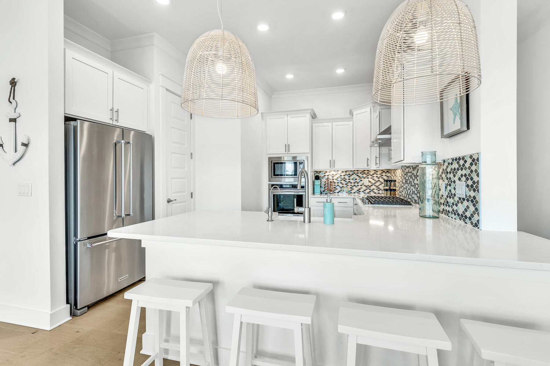 110 Wharf Ln Inlet Beach, Unit C Inlet Beach, FL 32461 - Photo 12 of 53 a kitchen with stainless steel appliances kitchen island granite countertop a refrigerator and a sink