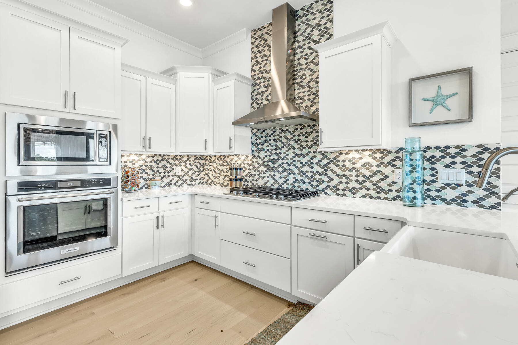 110 Wharf Ln Inlet Beach, Unit C Inlet Beach, FL 32461 - Photo 13 of 53 a kitchen with white cabinets and white appliances