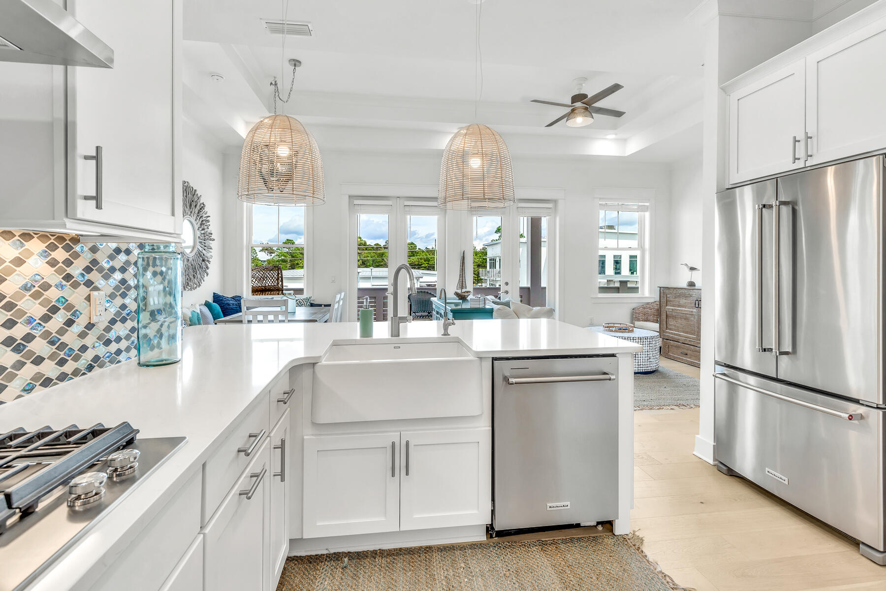 110 Wharf Ln Inlet Beach, Unit C Inlet Beach, FL 32461 - Photo 15 of 53 a kitchen with white cabinets and stainless steel appliances