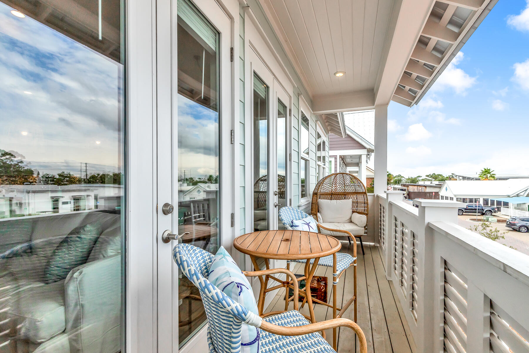 110 Wharf Ln Inlet Beach, Unit C Inlet Beach, FL 32461 - Photo 17 of 53 a balcony with table and chairs