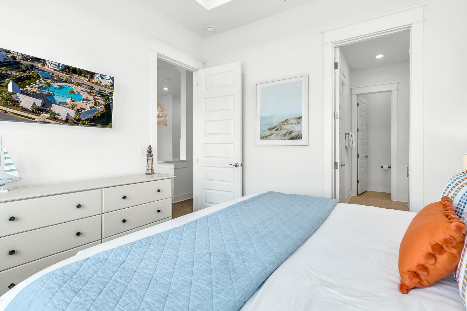 110 Wharf Ln Inlet Beach, Unit C Inlet Beach, FL 32461 - Photo 21 of 53 a bedroom with a bed and painting on the wall