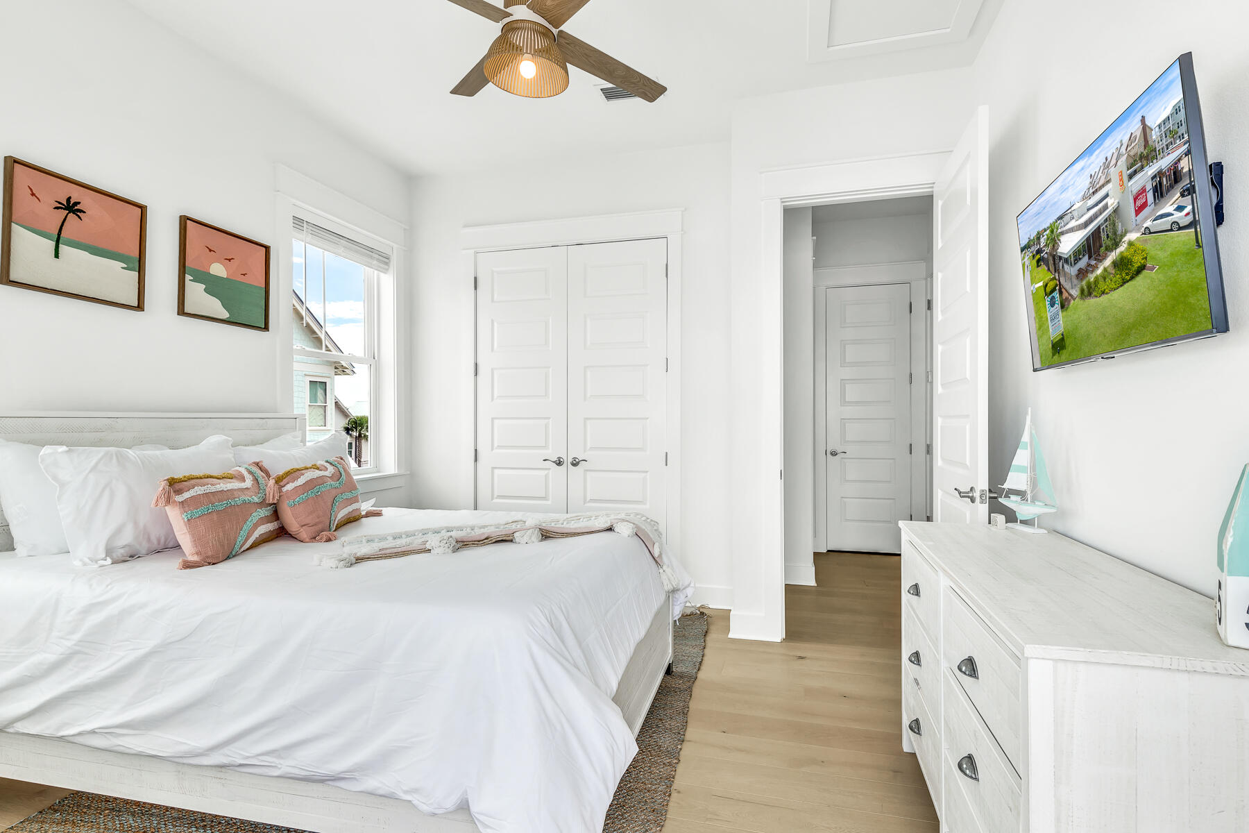 110 Wharf Ln Inlet Beach, Unit C Inlet Beach, FL 32461 - Photo 25 of 53 a spacious bedroom with a bed and a chandelier
