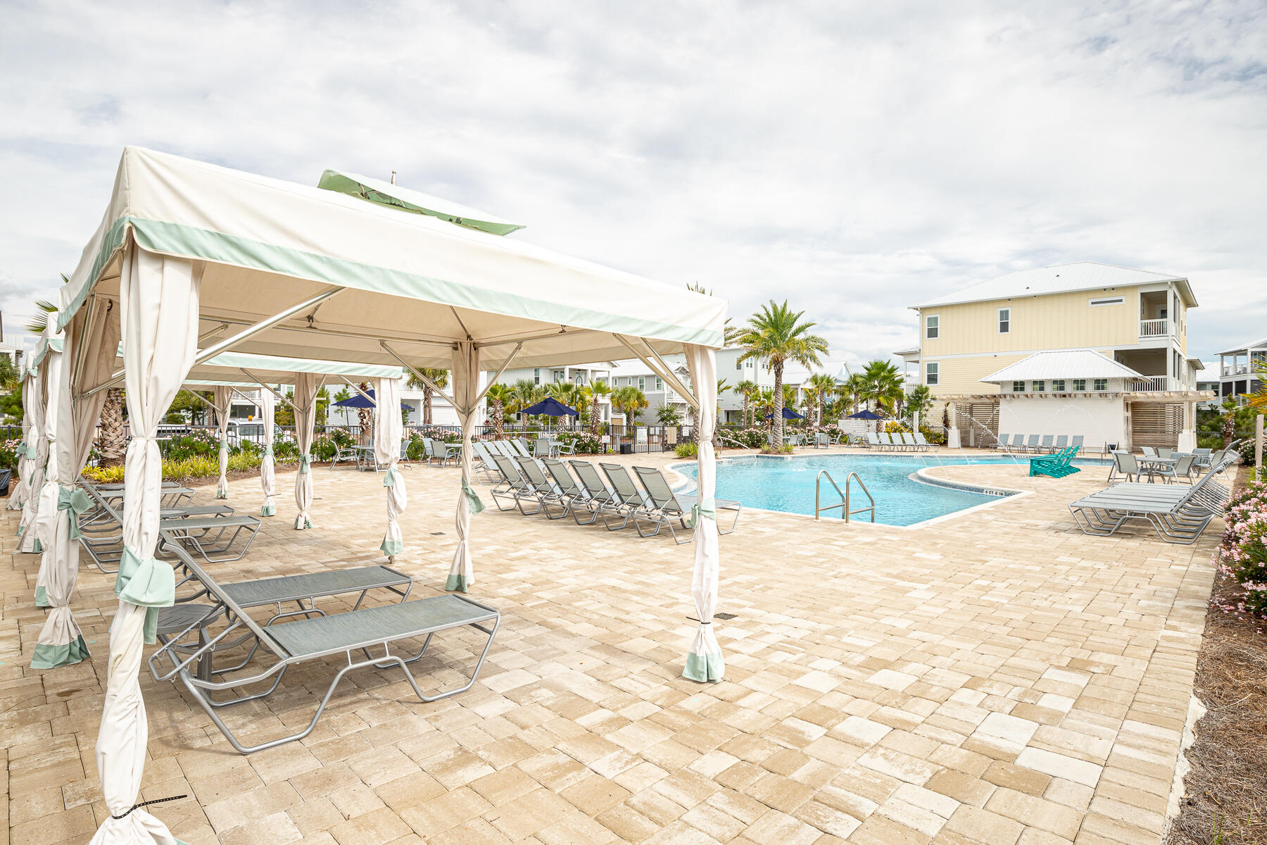 110 Wharf Ln Inlet Beach, Unit C Inlet Beach, FL 32461 - Photo 33 of 53 a view of a swimming pool with a lounge chairs