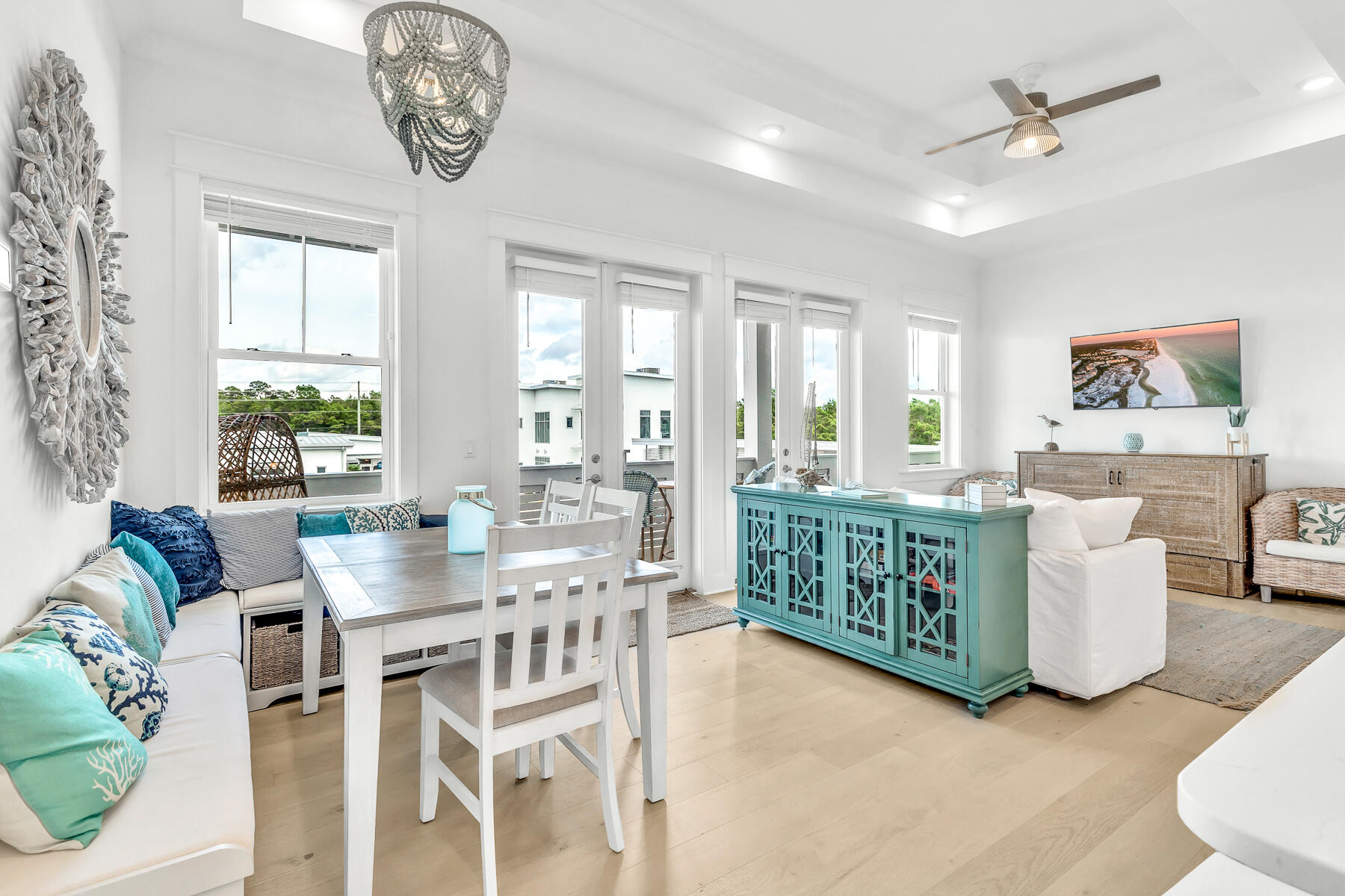 110 Wharf Ln Inlet Beach, Unit C Inlet Beach, FL 32461 - Photo 5 of 53 a dining room with furniture a chandelier and wooden floor