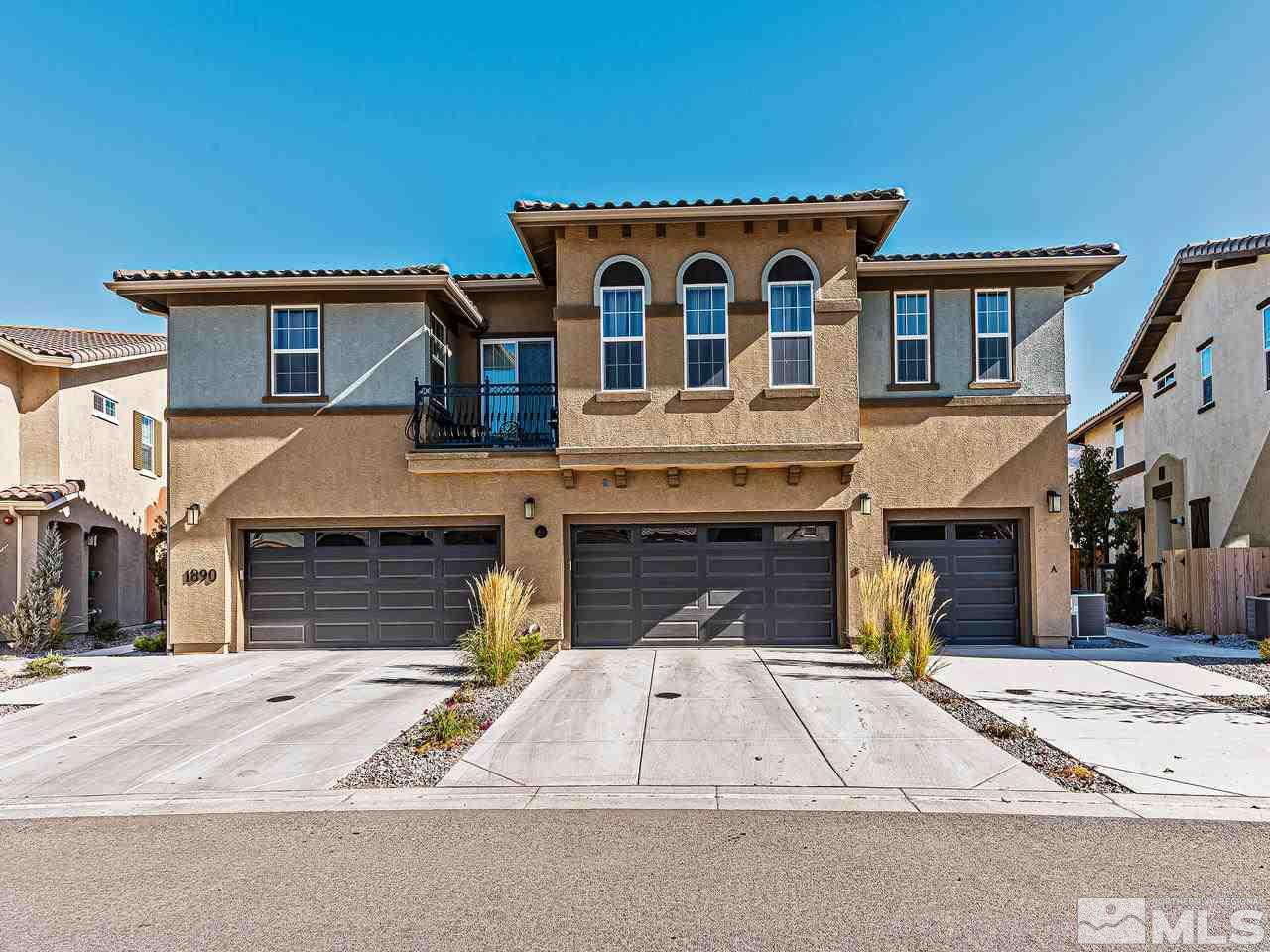 1890 Dark Horse Road, Unit 1062 Reno, NV 89521 - Photo 2 of 19 a front view of a house with a yard