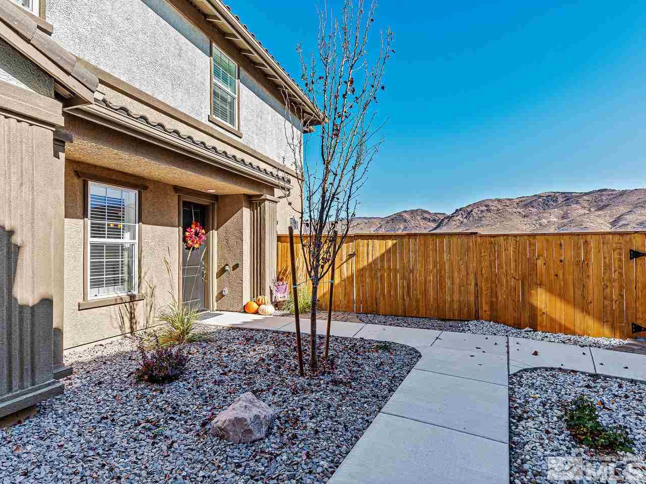 1890 Dark Horse Road, Unit 1062 Reno, NV 89521 - Photo 3 of 19 a front view of a house with garden
