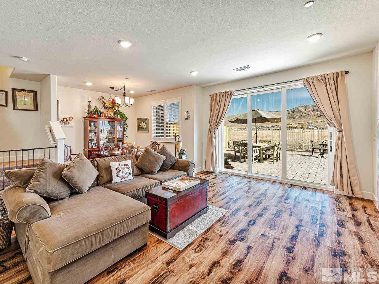 1890 Dark Horse Road, Unit 1062 Reno, NV 89521 - Photo 4 of 19 a living room with furniture and a flat screen tv
