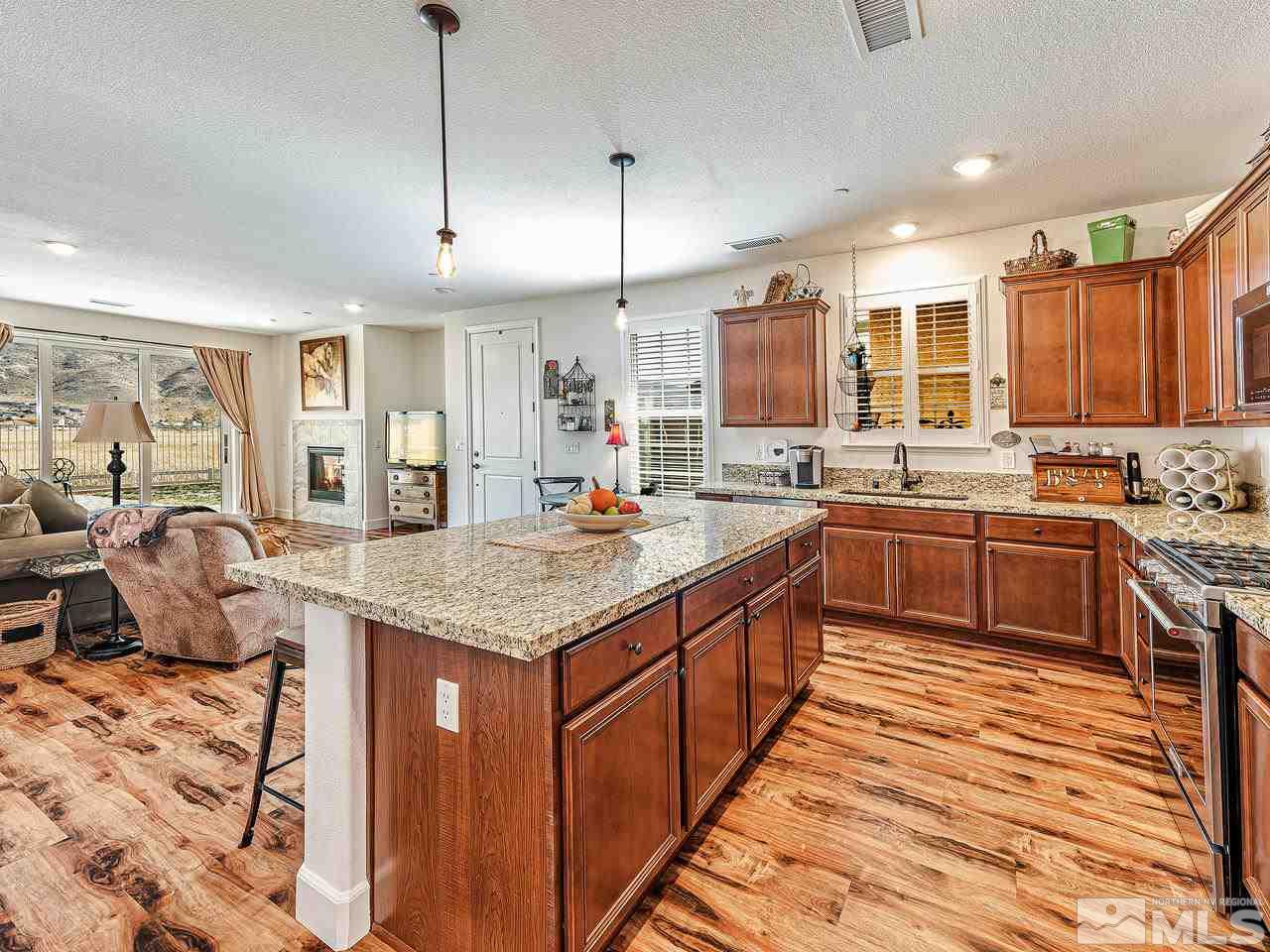 1890 Dark Horse Road, Unit 1062 Reno, NV 89521 - Photo 8 of 19 a kitchen with stainless steel appliances granite countertop a sink stove and refrigerator