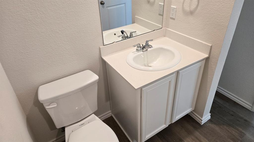 920 Jefferson Way Sherman, TX 75090 - Photo 1 of 21 a bathroom with a sink a toilet and mirror