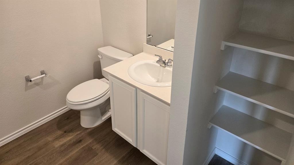 920 Jefferson Way Sherman, TX 75090 - Photo 2 of 21 a white toilet sitting next to a bathroom sink