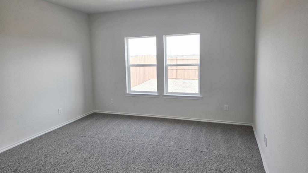 920 Jefferson Way Sherman, TX 75090 - Photo 9 of 21 an empty room with a window