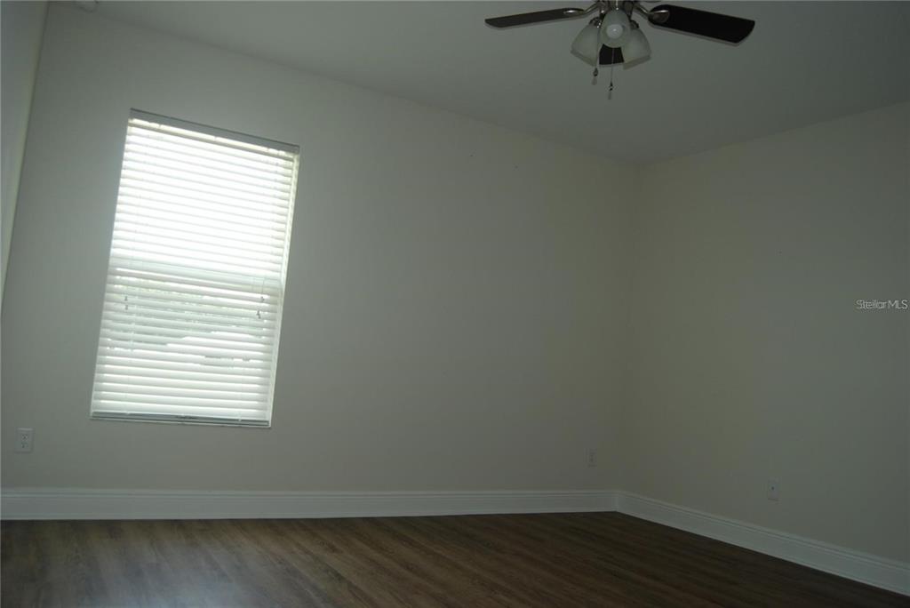 1167 Southeast 63rd Ct Road Ocala, FL 34472 - Photo 22 of 37 an empty room with a window