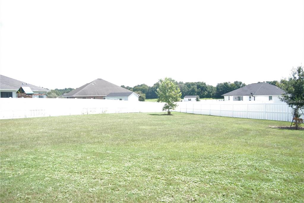 1167 Southeast 63rd Ct Road Ocala, FL 34472 - Photo 26 of 37 a view of a lake with houses