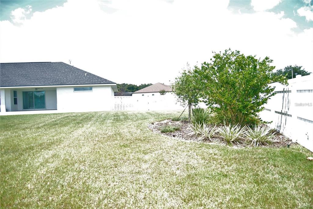 1167 Southeast 63rd Ct Road Ocala, FL 34472 - Photo 28 of 37 a view of a house with a yard
