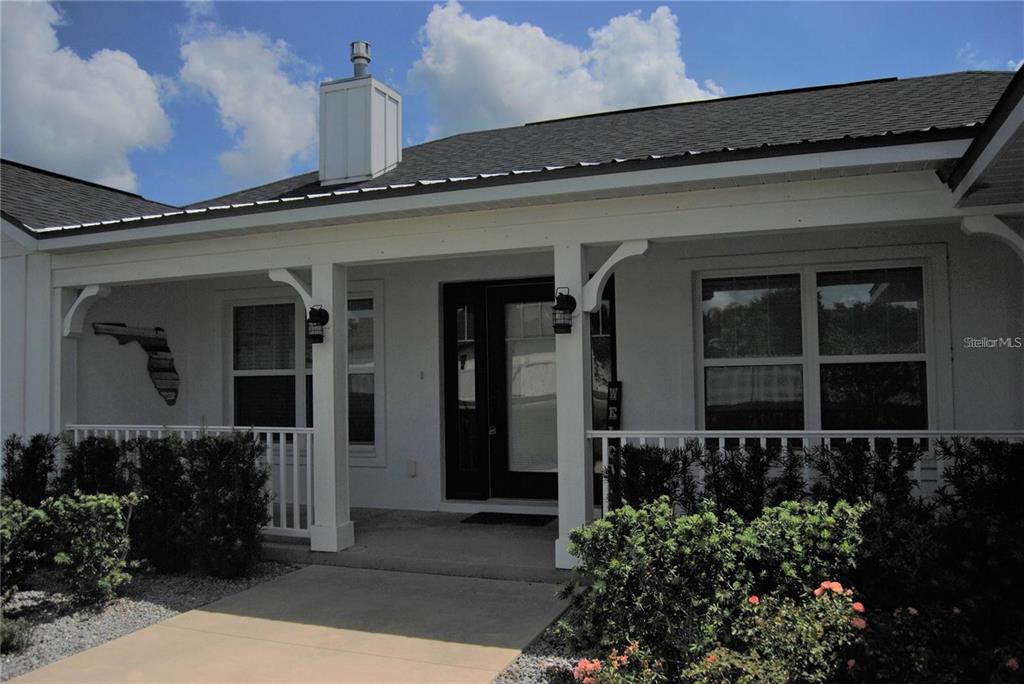 1167 Southeast 63rd Ct Road Ocala, FL 34472 - Photo 35 of 37 front view of a house with a small yard