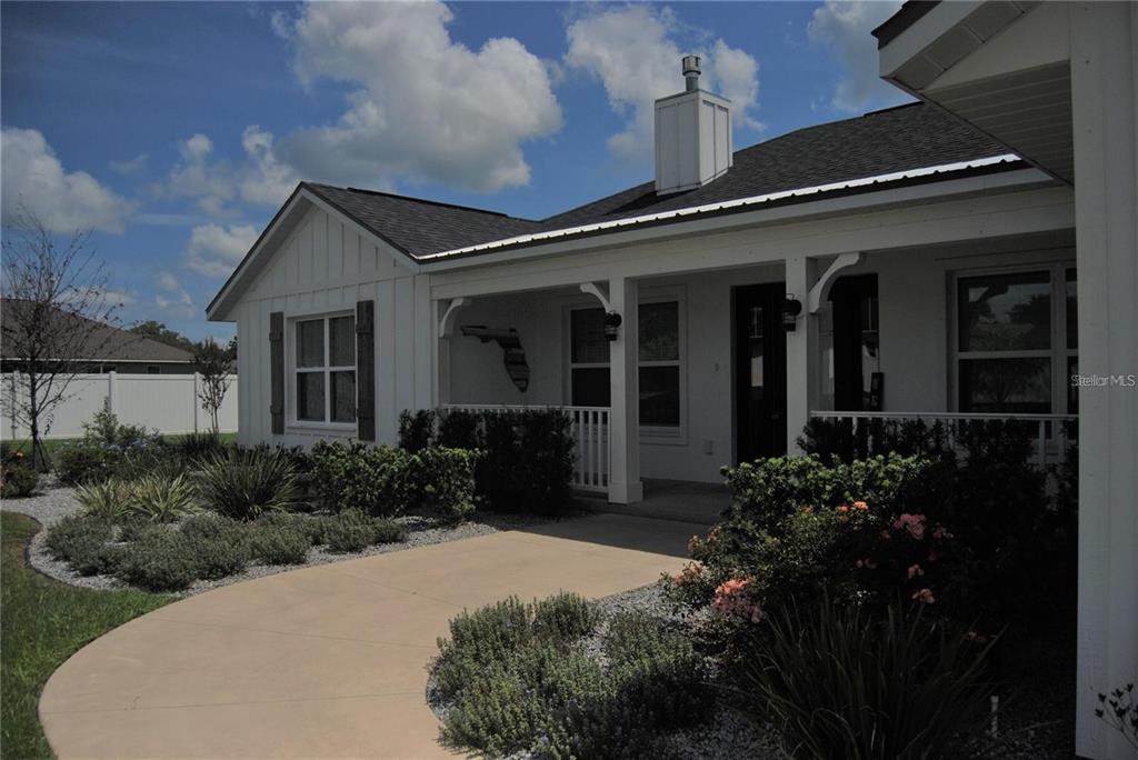 1167 Southeast 63rd Ct Road Ocala, FL 34472 - Photo 36 of 37 front view of house with a yard
