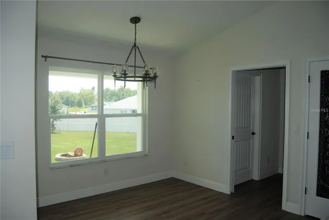 a room with window and wooden floor