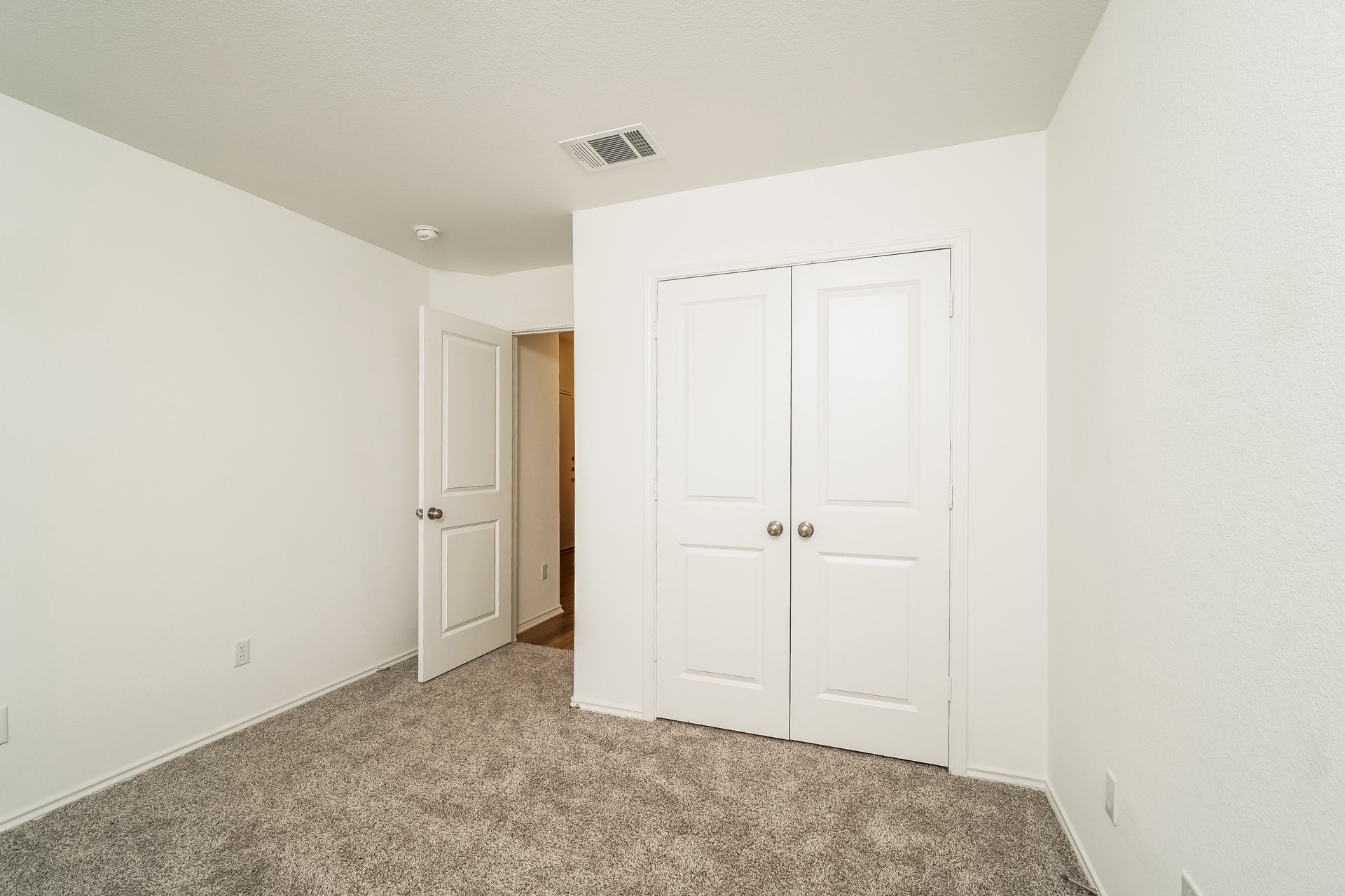 341 Madrid Kyle, TX 78640 - Photo 20 of 27 A well-proportioned room with soft carpeting offers comfortable living.