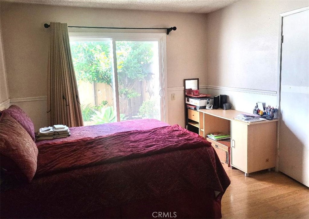 4543 Bodega Court Montclair, CA 91763 - Photo 7 of 11 Primary bedroom w slider to private patio