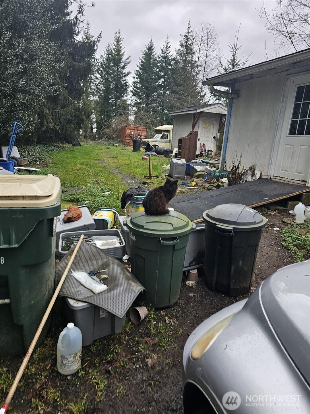 646 Jorgensen Road Onalaska, WA 98570 - Photo 8 of 14 a view of a patio with table and chairs potted plants with wooden floor