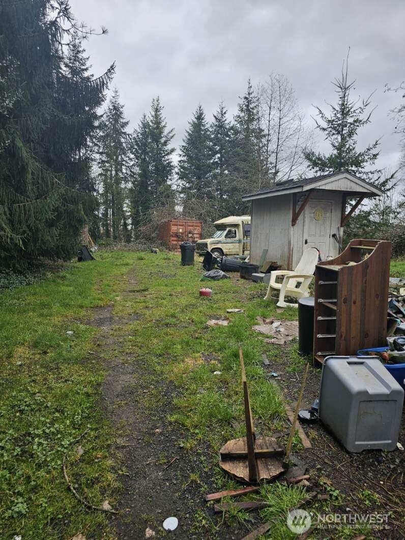 646 Jorgensen Road Onalaska, WA 98570 - Photo 10 of 14 a backyard of a house with table and chairs