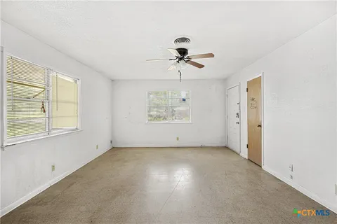 a view of an empty room with a window