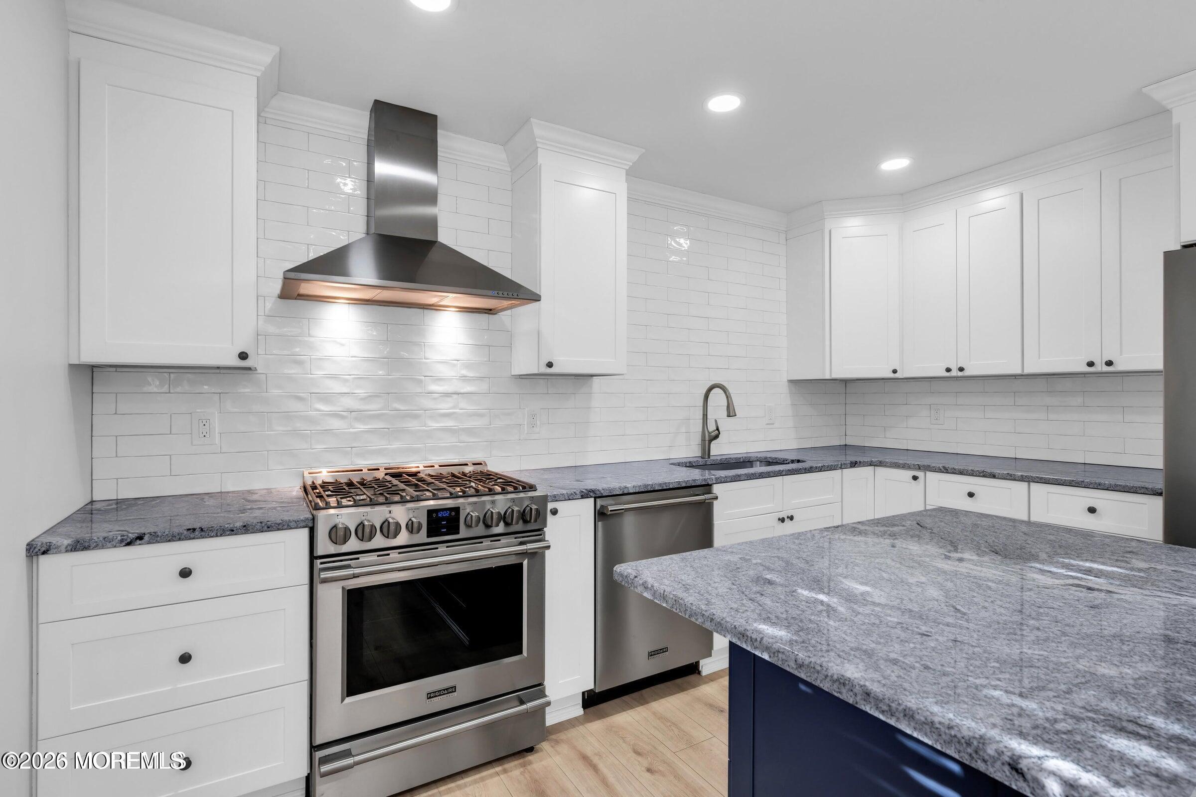 283 Spring Street, Unit 3A Red Bank, NJ 07701 - Photo 1 of 21 a kitchen with a stove and a sink