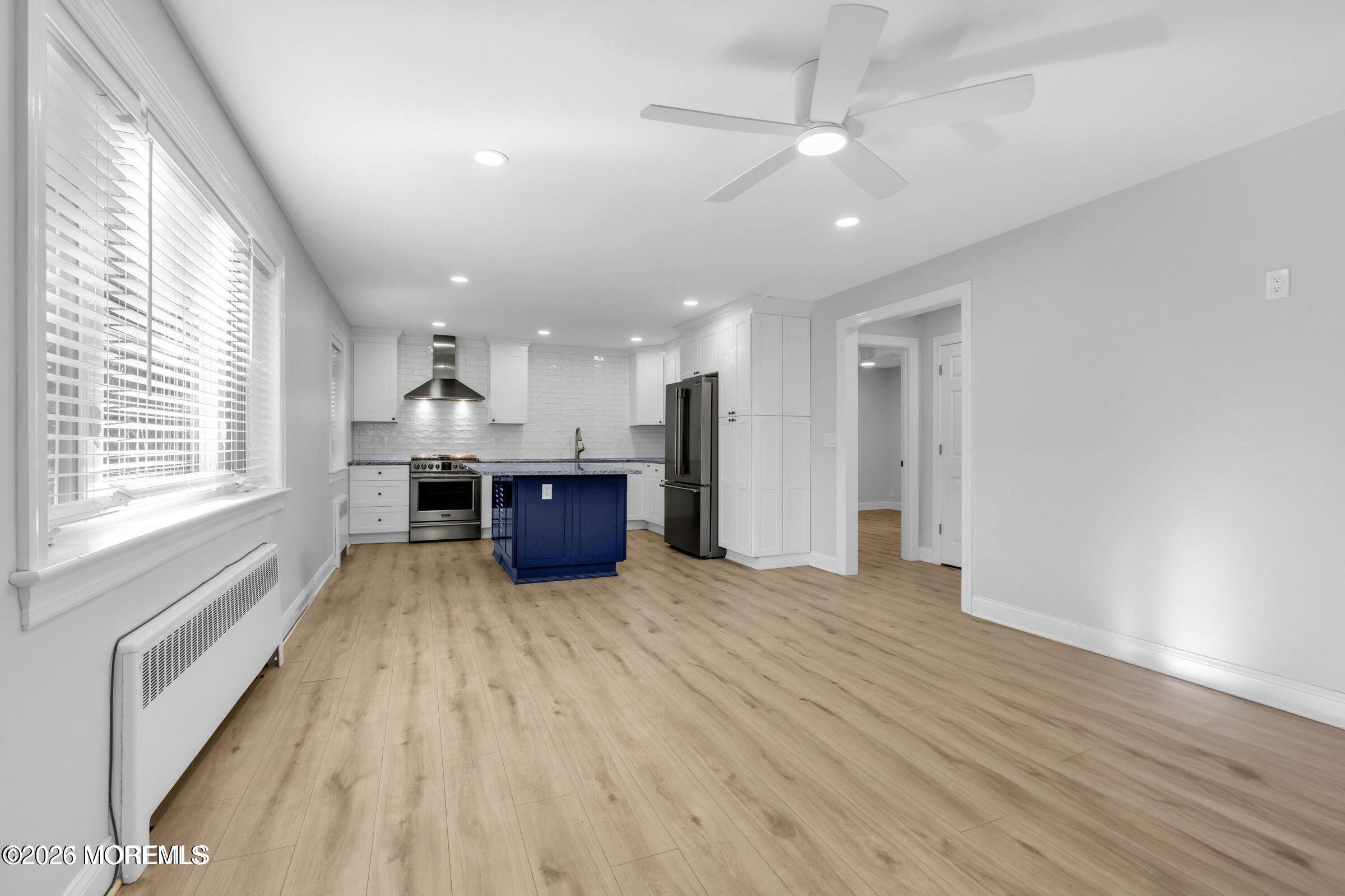283 Spring Street, Unit 3A Red Bank, NJ 07701 - Photo 7 of 21 a view of kitchen with sink and wooden floor