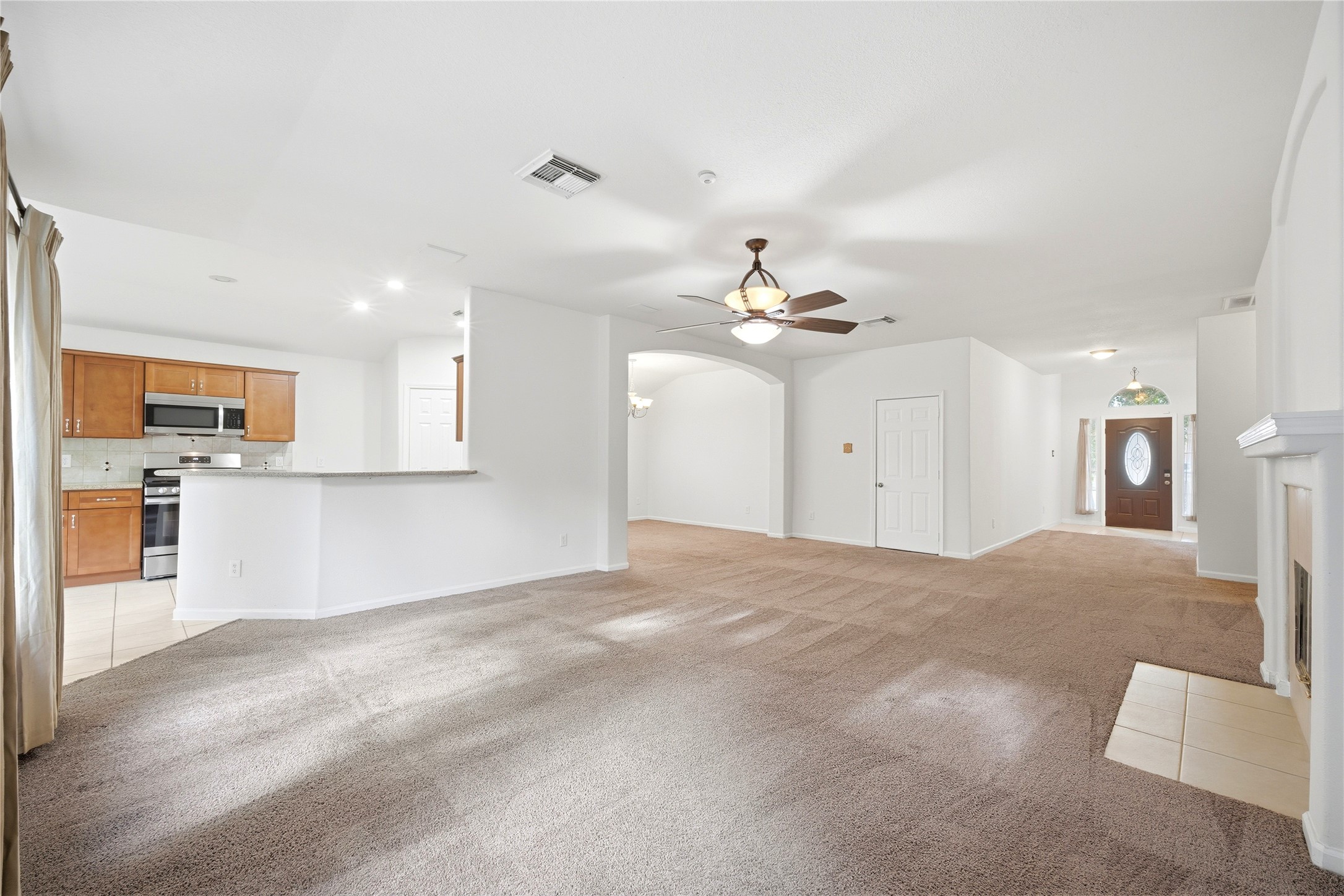 5411 Gate Canyon Court Spring, TX 77373 - Photo 9 of 33 a view of a kitchen with a sink and chandelier fan