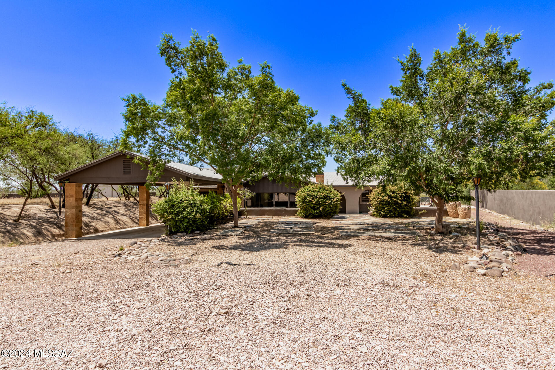 1242 Dodo Court Rio Rico, AZ 85648 - Photo 4 of 46 a front view of a house with a yard