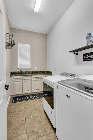 a utility room with washer and dryer