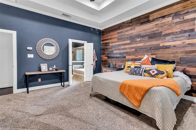 a bedroom with a bed and a table