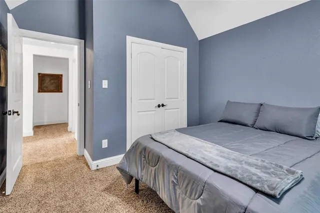 a bedroom with a bed and closet