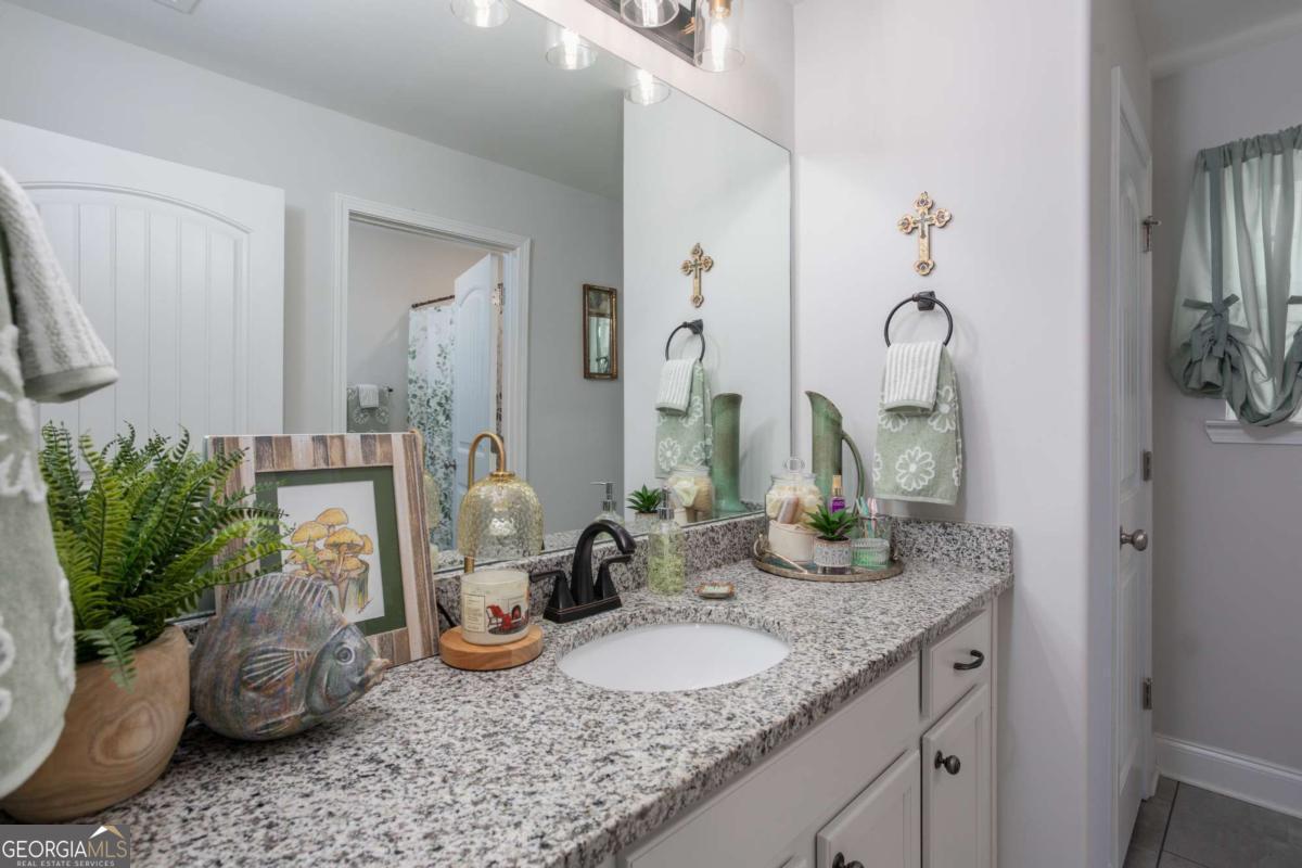 439 Gov Treutlen Circle Pooler, GA 31322 - Photo 14 of 21 a bathroom with sink and mirror