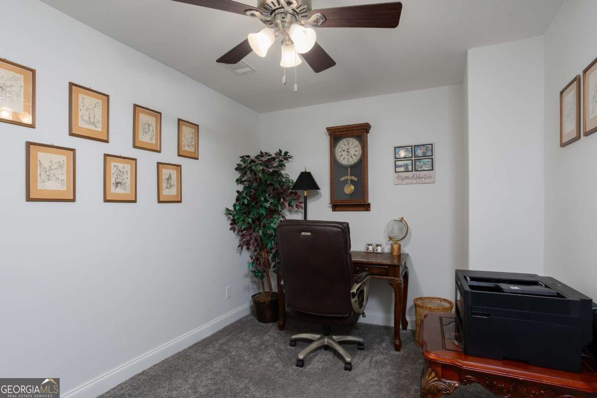 439 Gov Treutlen Circle Pooler, GA 31322 - Photo 16 of 21 a view of a workspace with furniture and a window