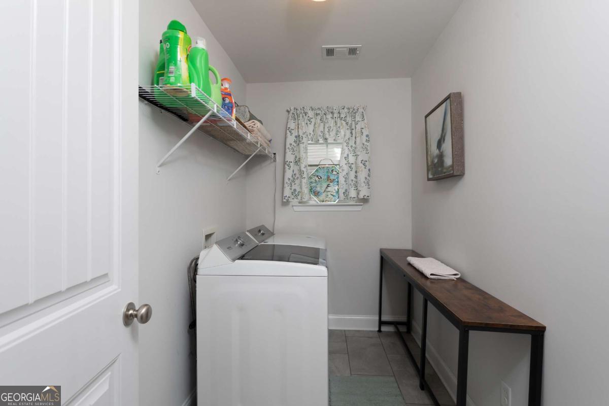 439 Gov Treutlen Circle Pooler, GA 31322 - Photo 17 of 21 a utility room with dryer and washer
