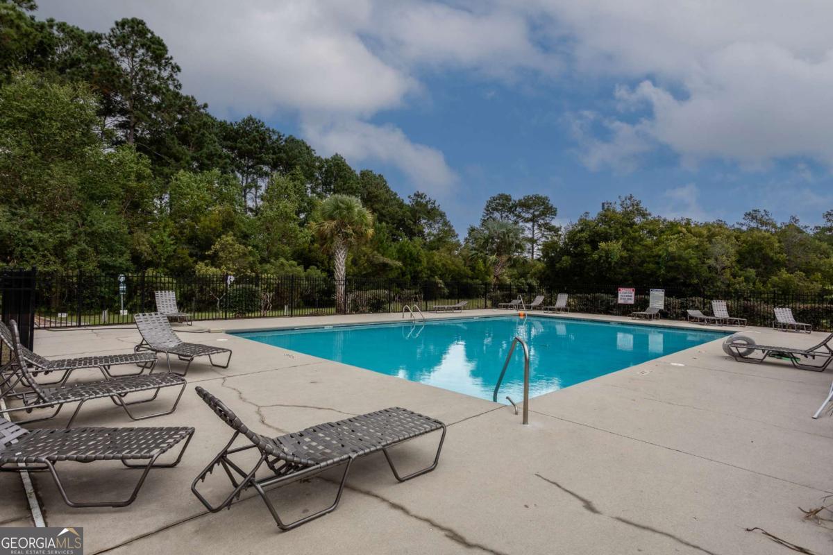 439 Gov Treutlen Circle Pooler, GA 31322 - Photo 20 of 21 a view of a swimming pool with lounge chairs