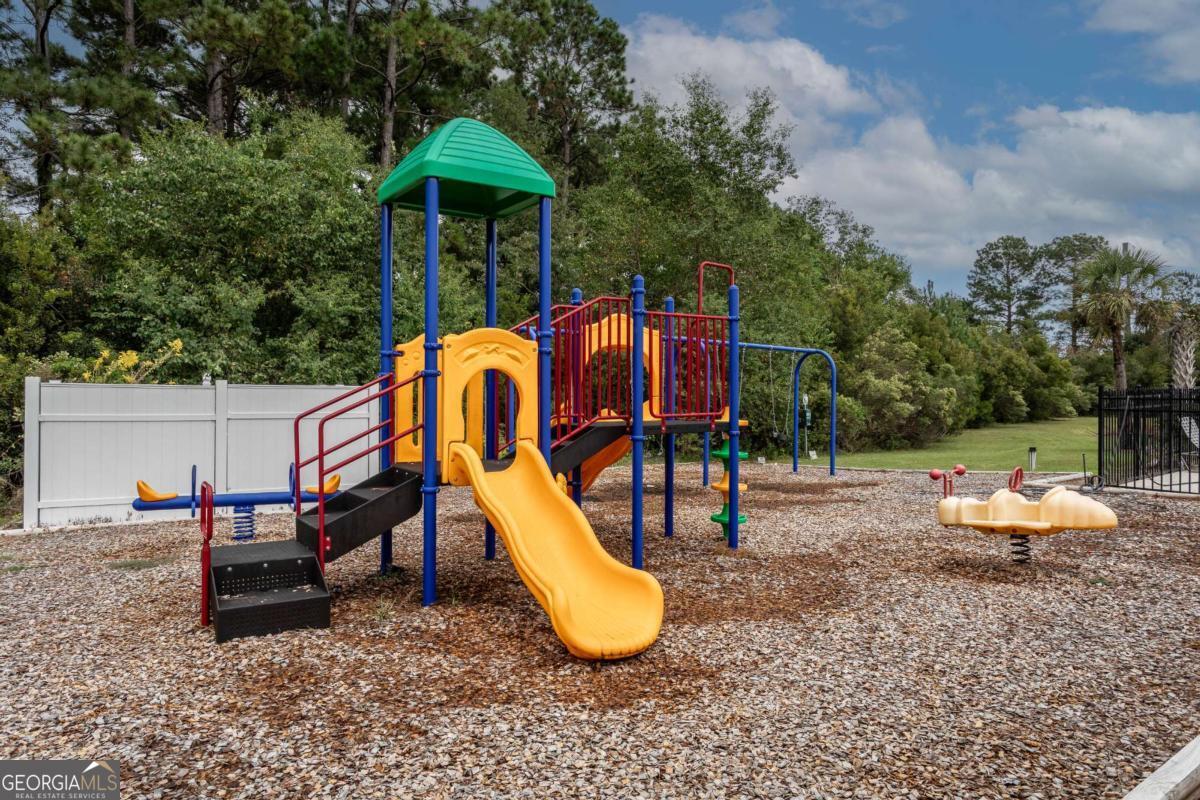 439 Gov Treutlen Circle Pooler, GA 31322 - Photo 21 of 21 a backyard of a house with table and chairs